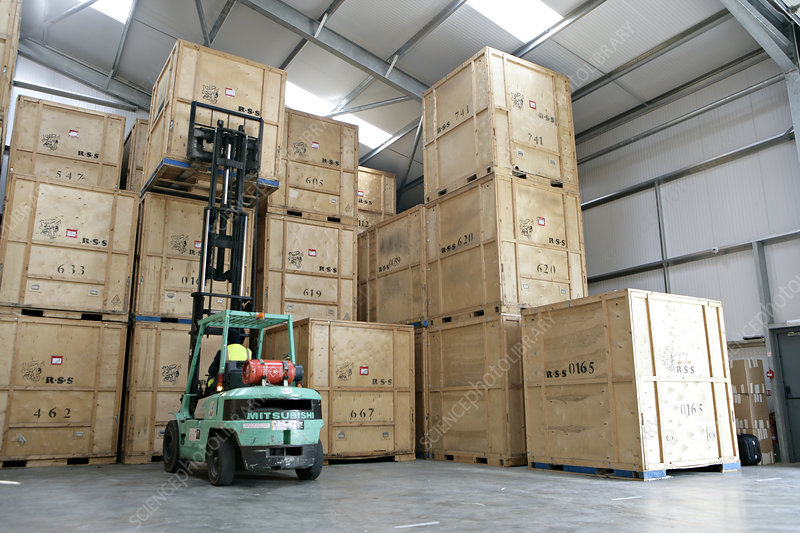 Crates in removals and storage facility Removals and storage facility. Storage crates in a warehouse storage facility at a company specialising in domestic removals and storage.